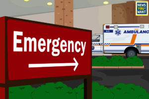 A red emergency sign outside of a hospital. An ambulance is also in view.
